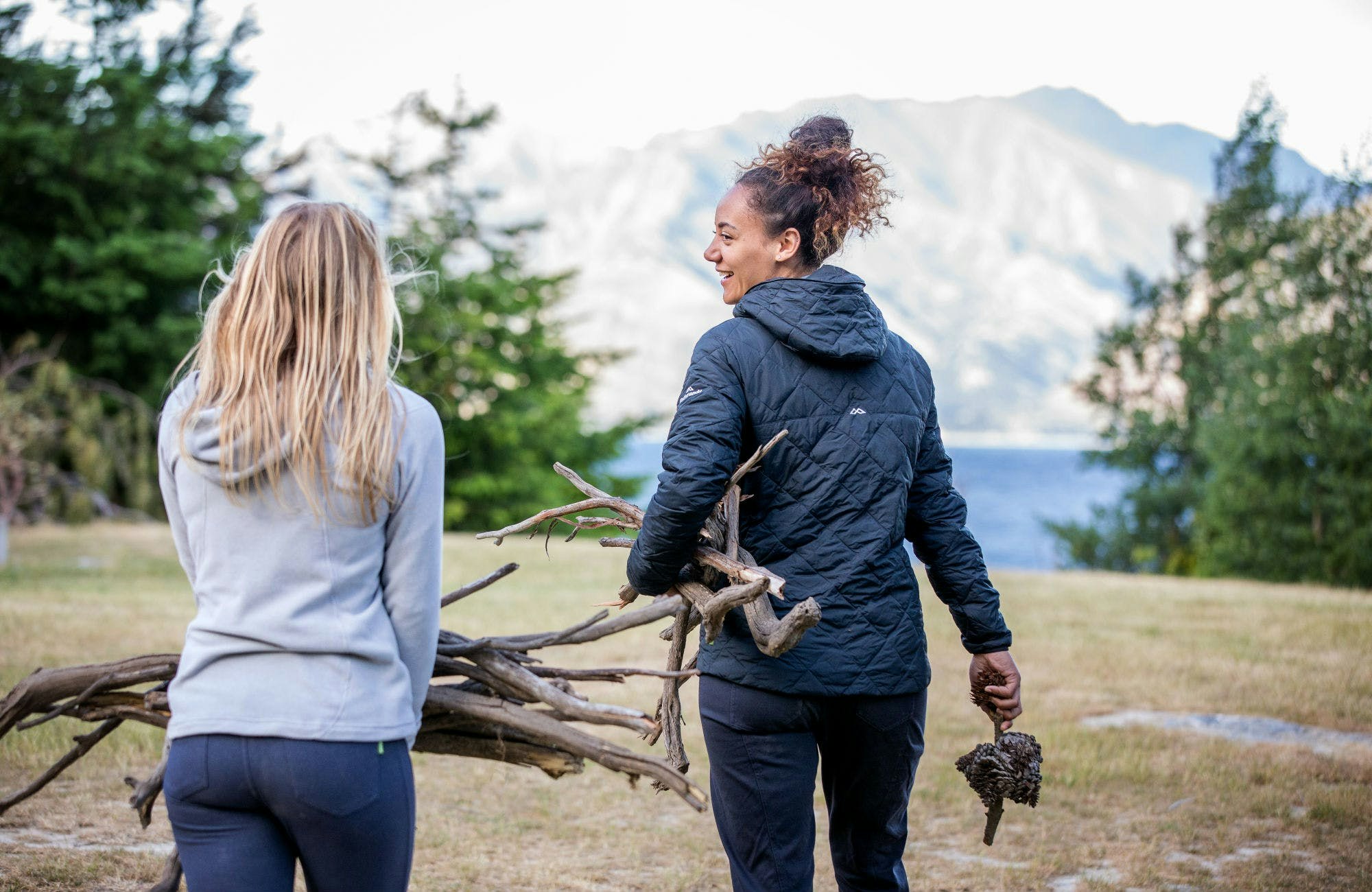 Autumn camping can be really comfortable with a campfire Campers collecting firewood