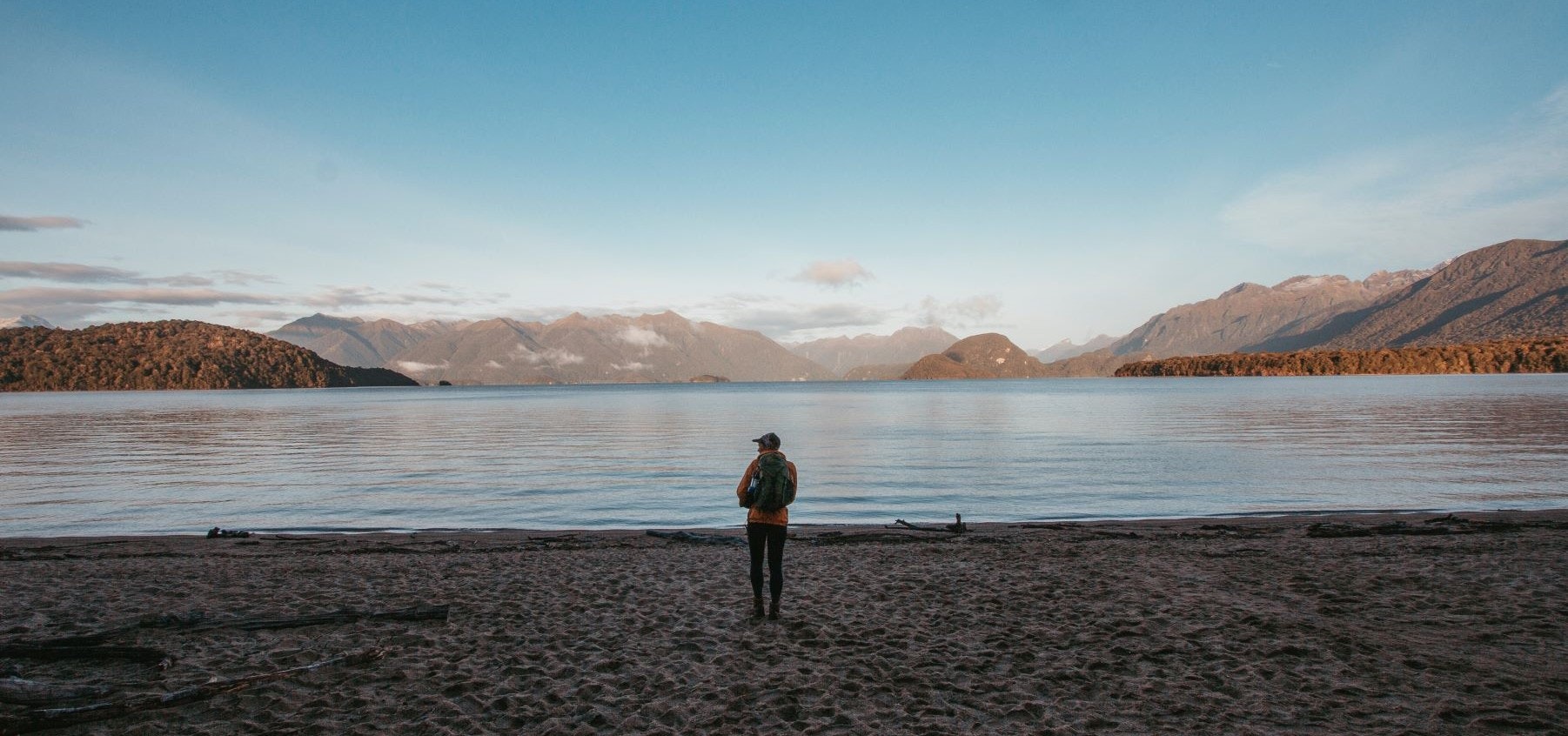 Woman by lake in Fiordlands National park
