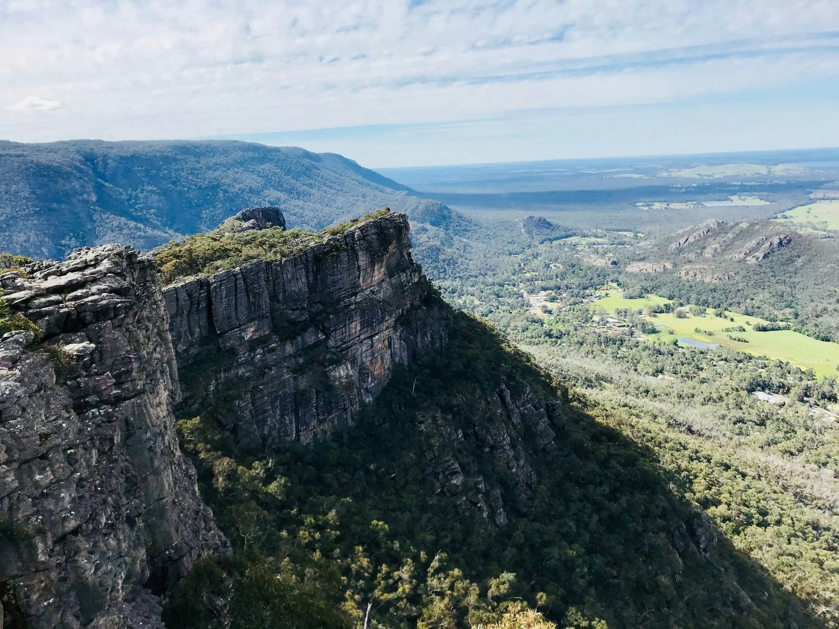 View from the Grampians of a cliff and farmland