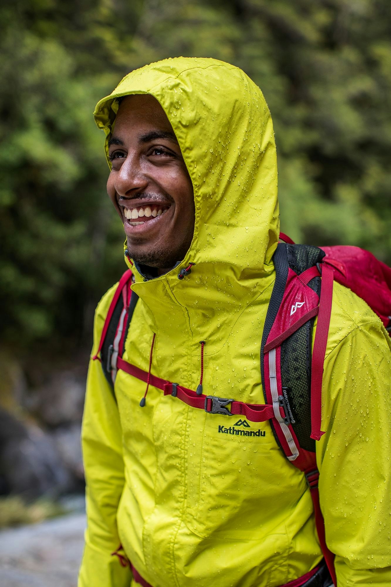 Kathmandu Trailhead jacket in action Man wearing Trailhead jacket in yellow