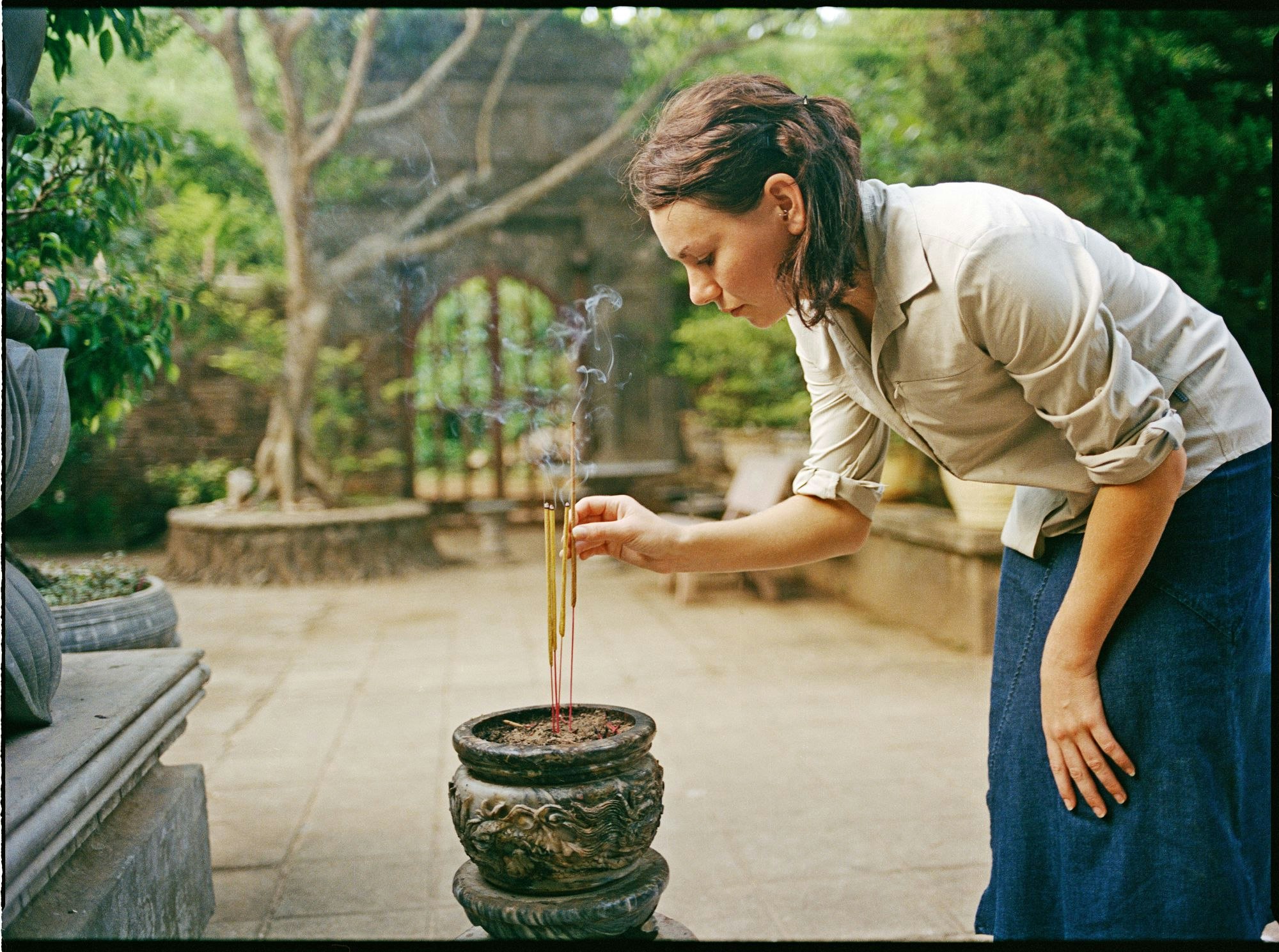 Woman lighting incense