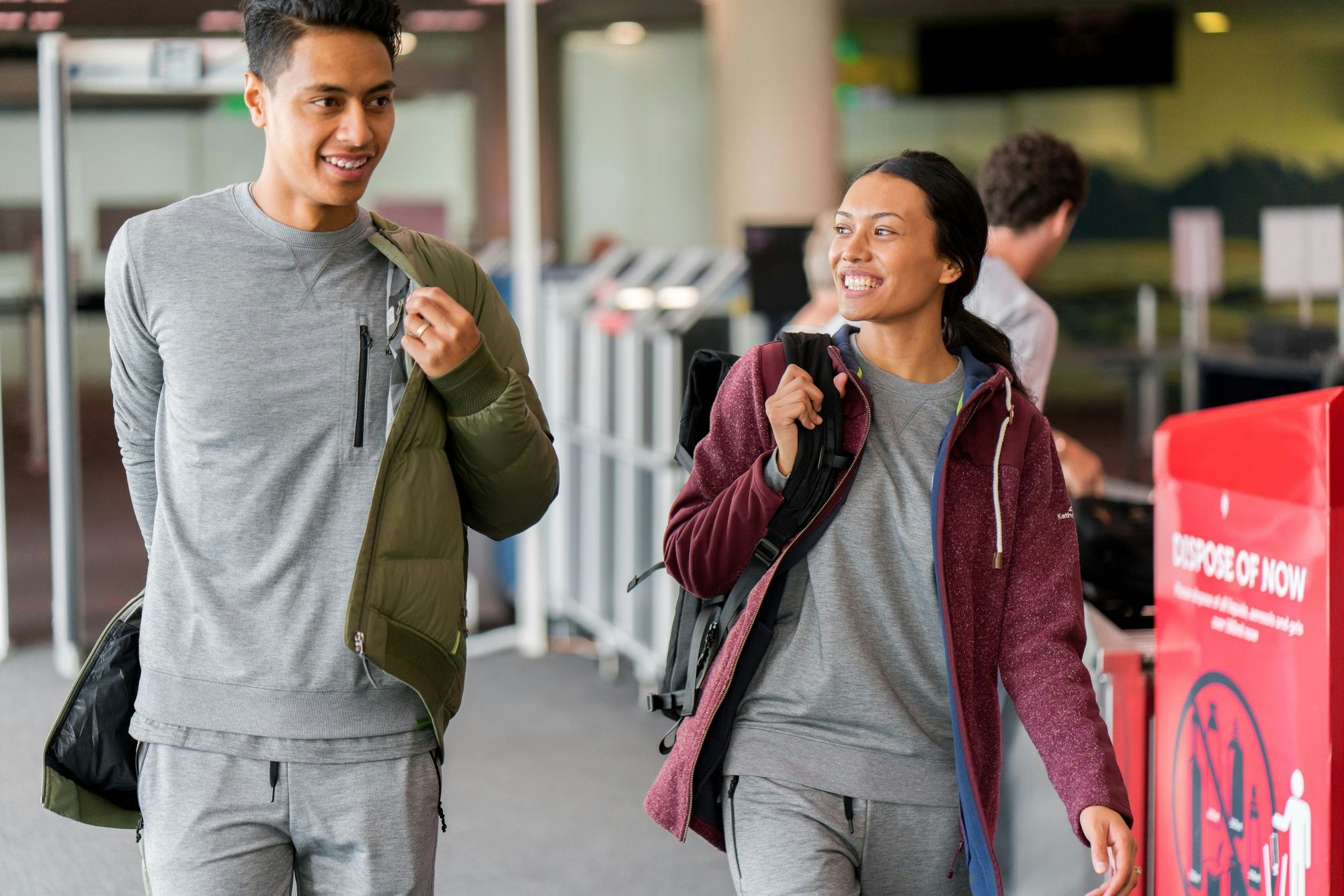 Two people wearing Federate clothes in an airport