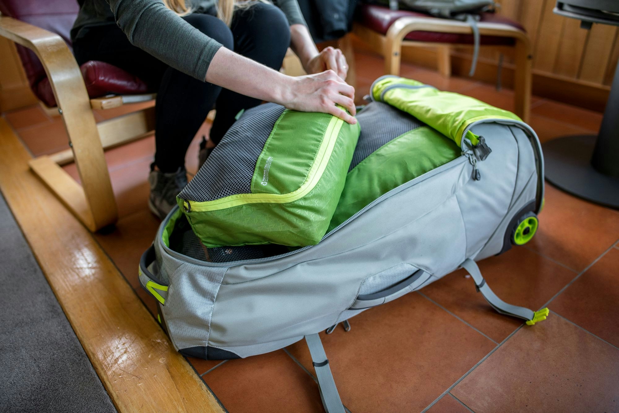 Packing cells help your organise your luggage Packing cells being placed into a backpack