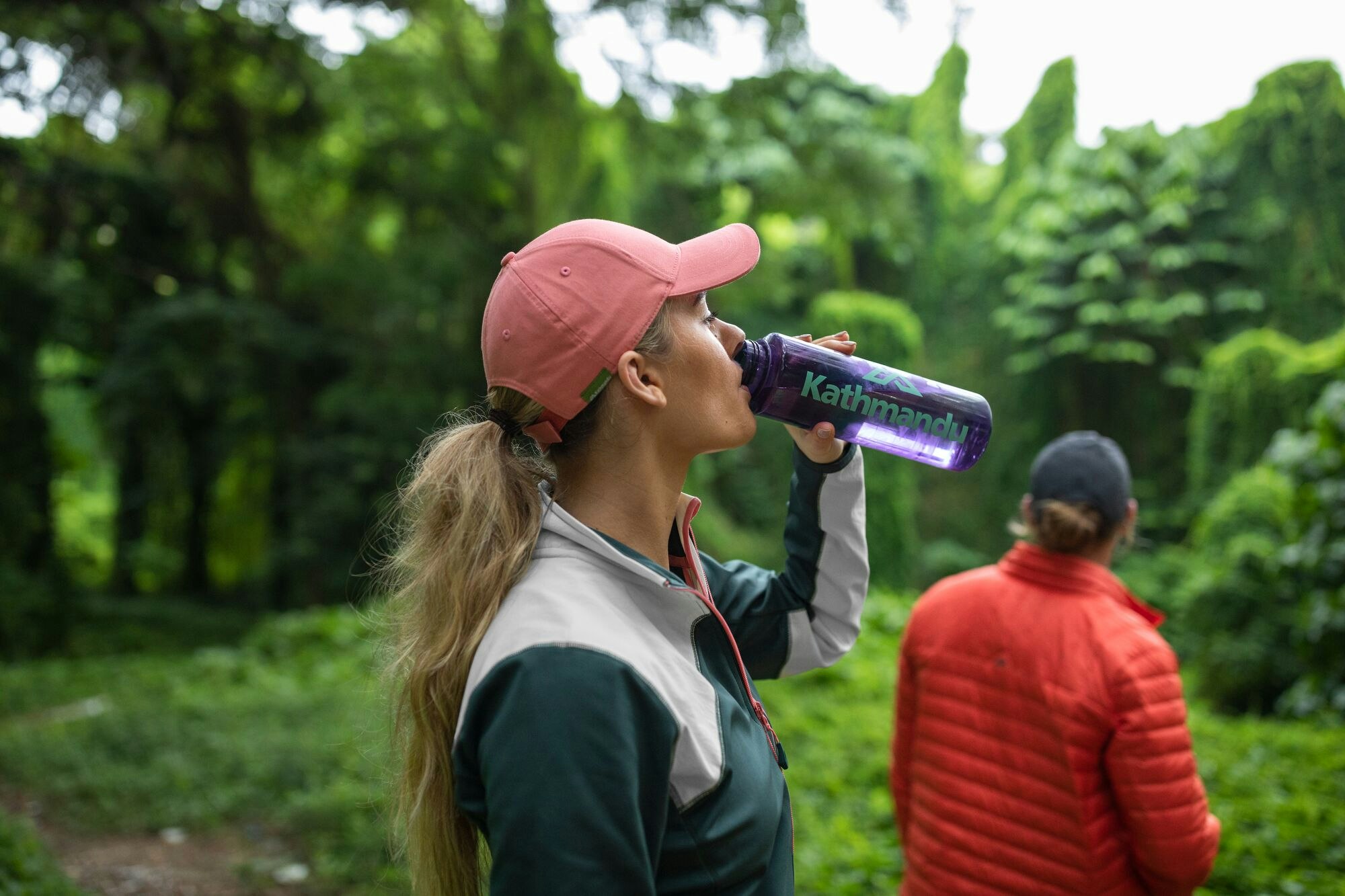 Woman drinking water from Kathmandu bottle