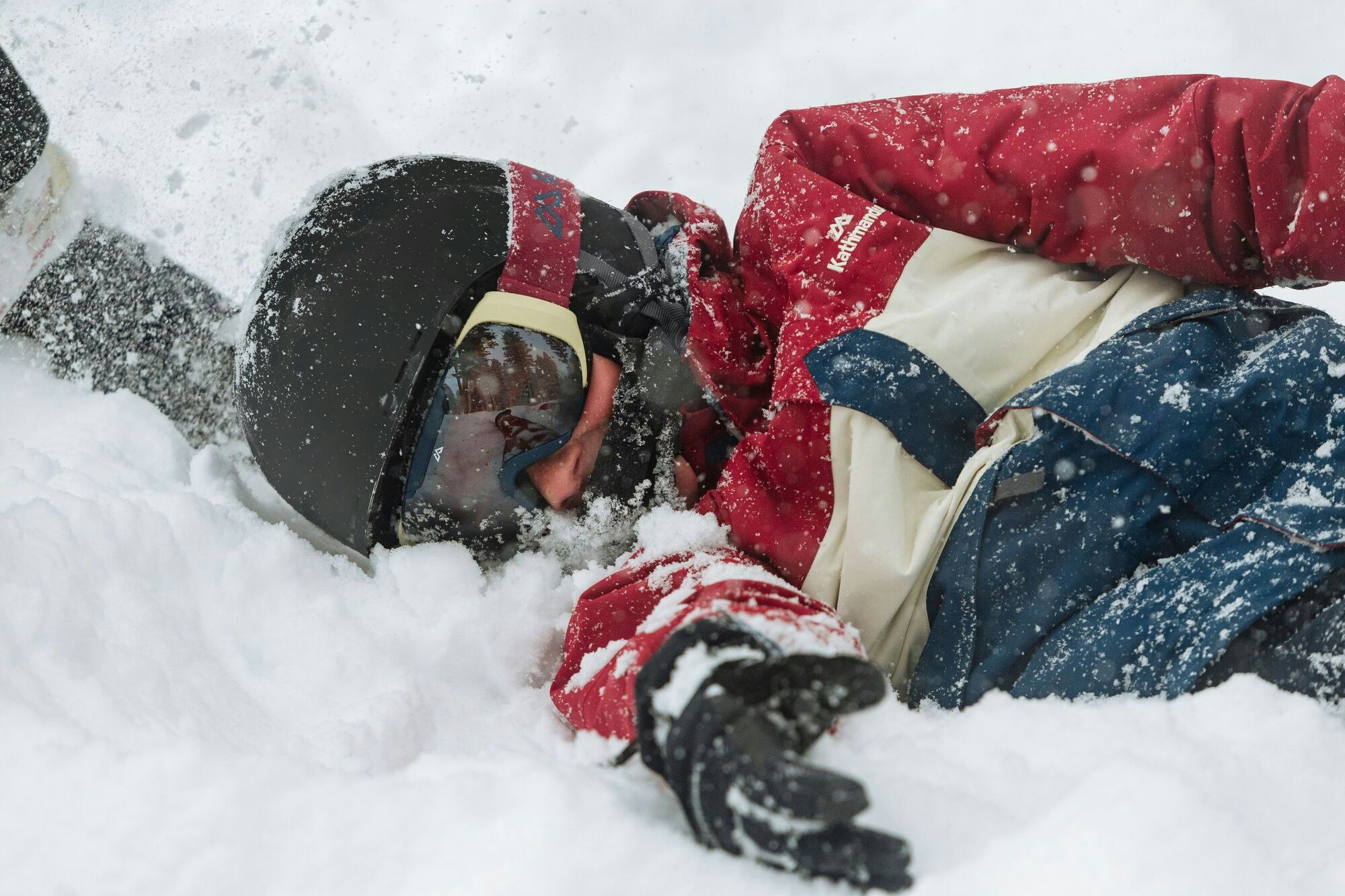 Maintain your strength and flexibility and you'll be up in no time Image of a man in the snow who has fallen from his snowboard