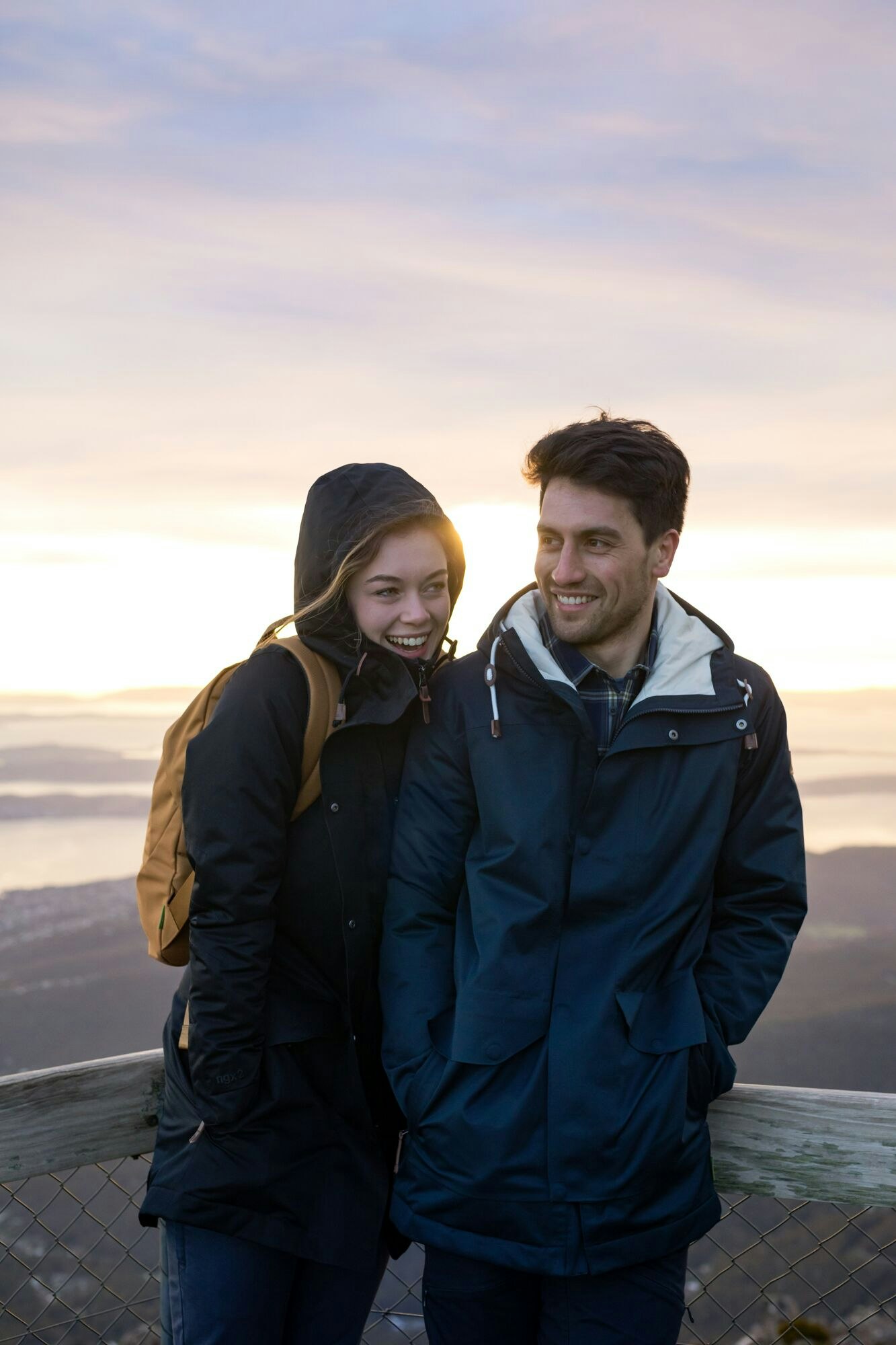 At home on the summit... Image of a man and woman snuggling with one another