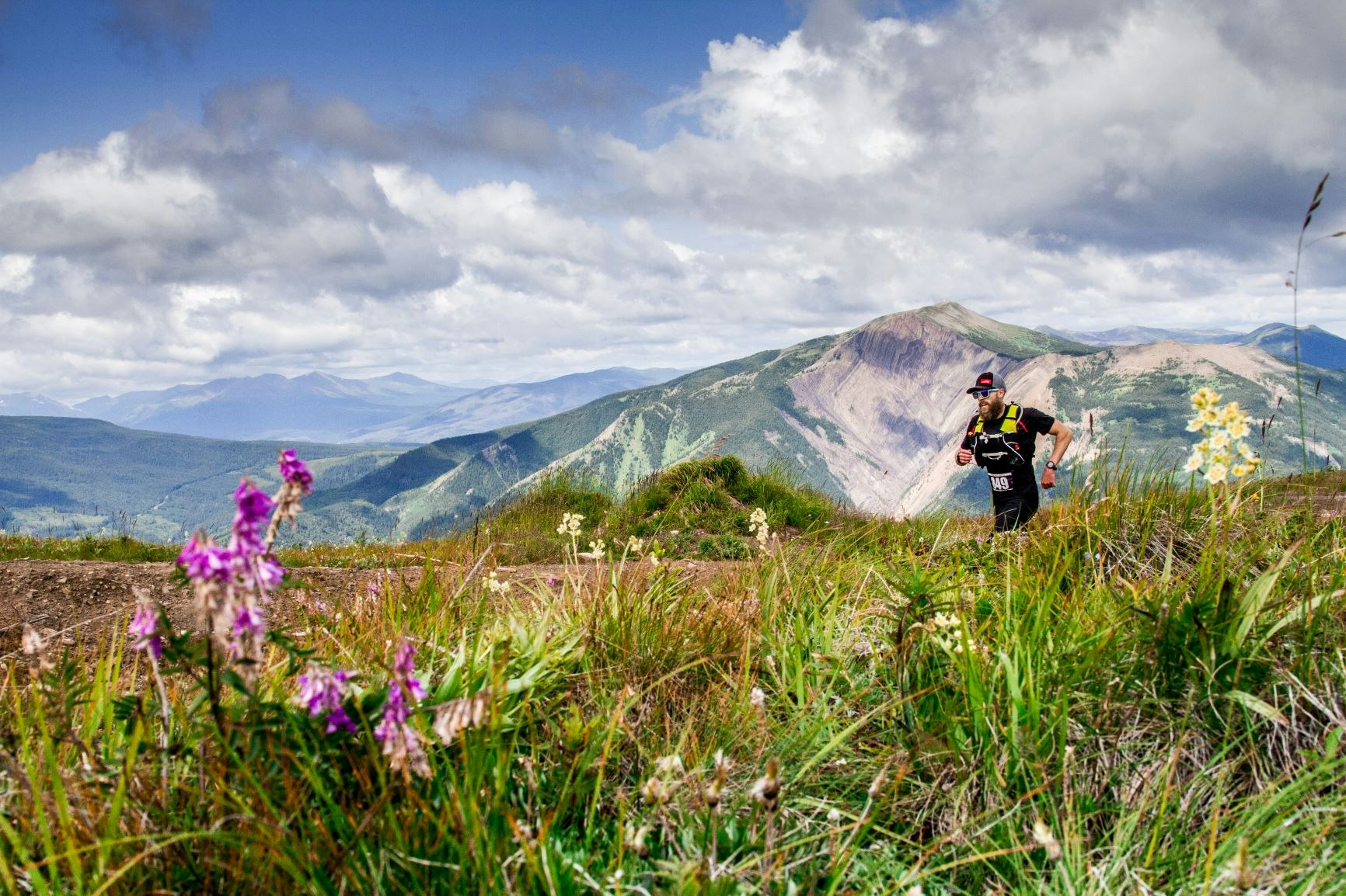 Man running in Canadian mountains in summer