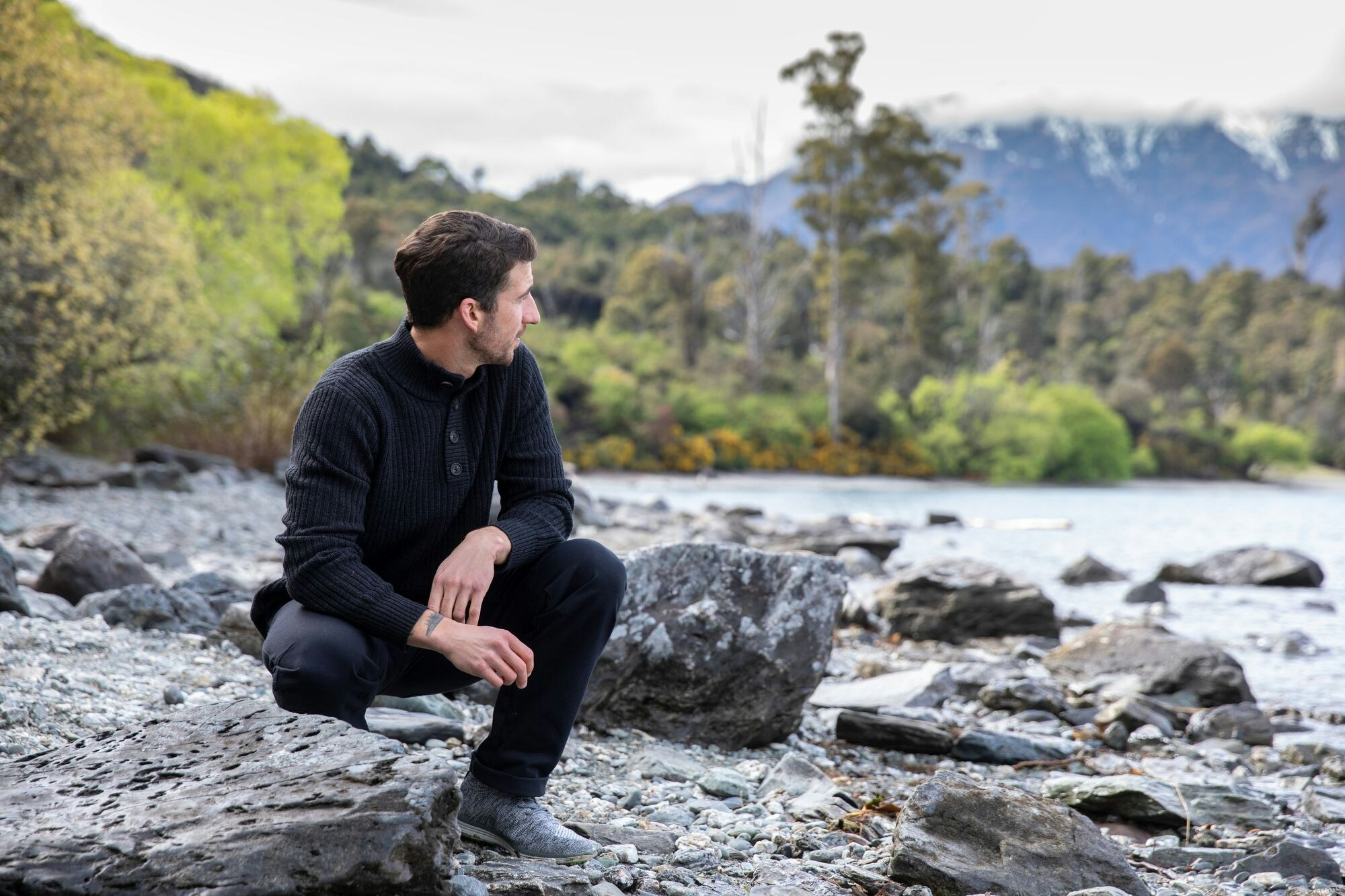 Man wearing Merino Jersey by river